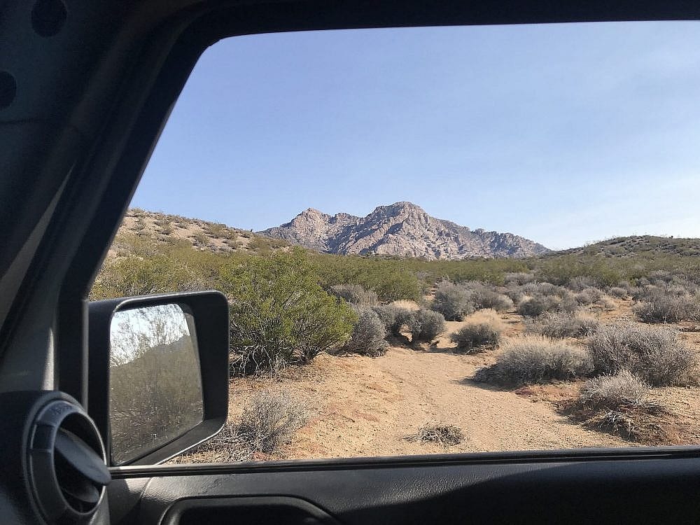 One Type of Geologist Field Vehicle (Jeep Wrangler JK) & A View of a Rock Formation in Cal-Nev-Ari, Nevada.